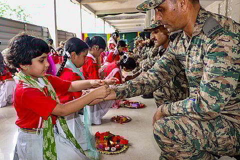Students tie 'rakhis' to Army personnel on the outskirts of Jammu